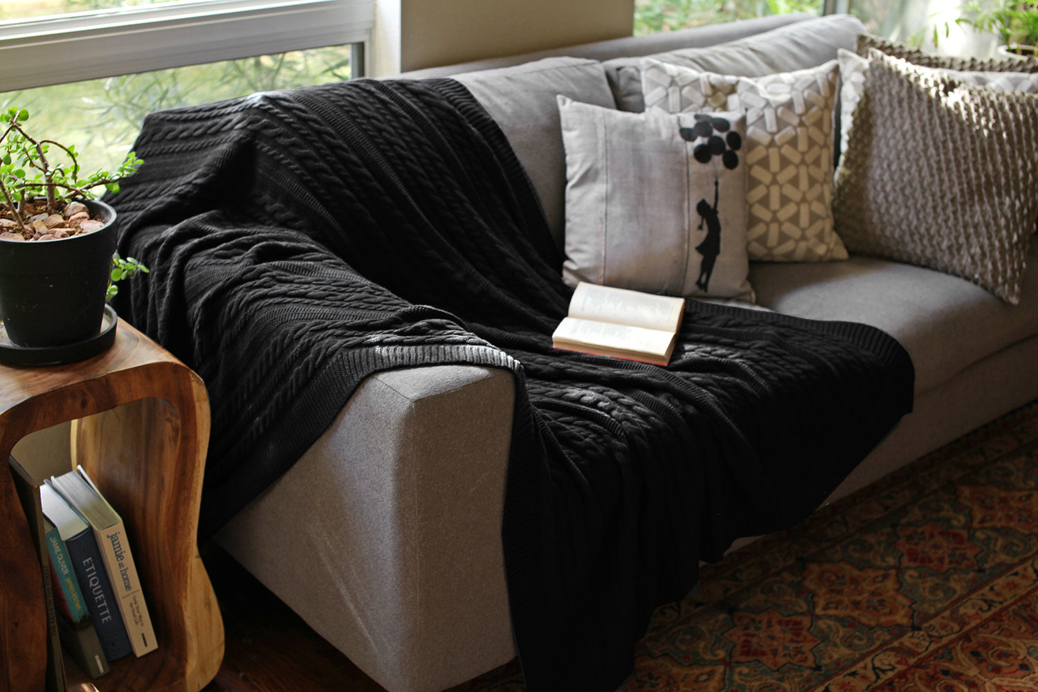 Viverano Organic Cotton Cozy Soft Cable Knit Throw Blanket on living room couch