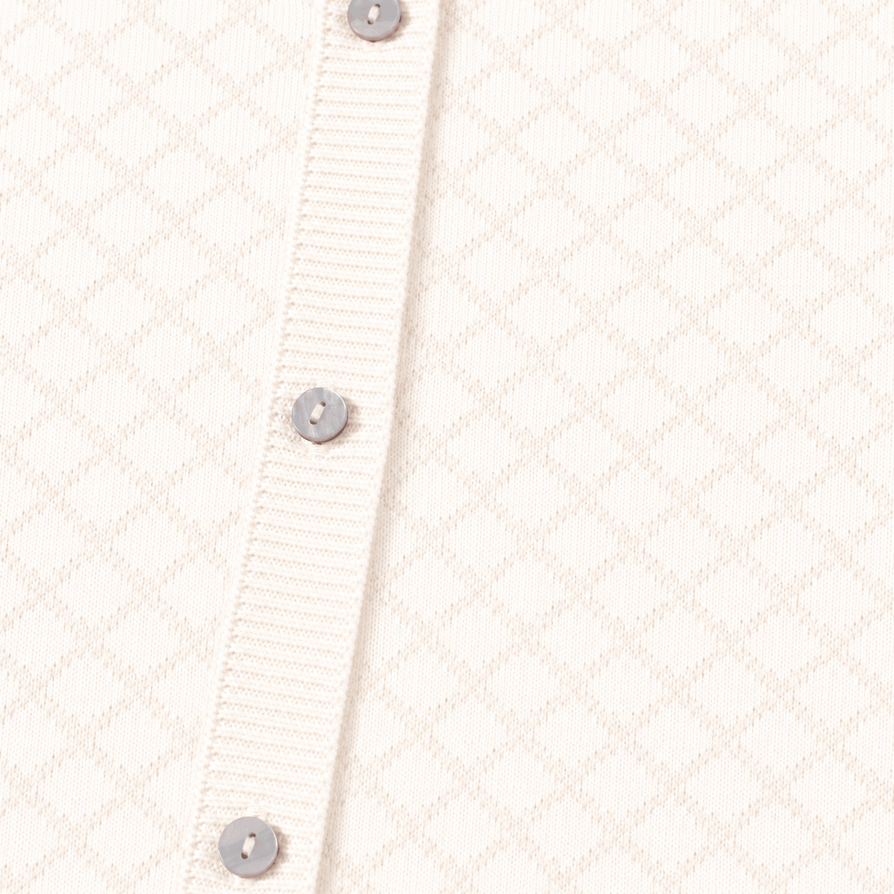 Close up of buttons and pattern on Milan Dove White Lux Jacquard Knit Baby Jumpsuit andHat and Bootie 3pc SET Organic cotton