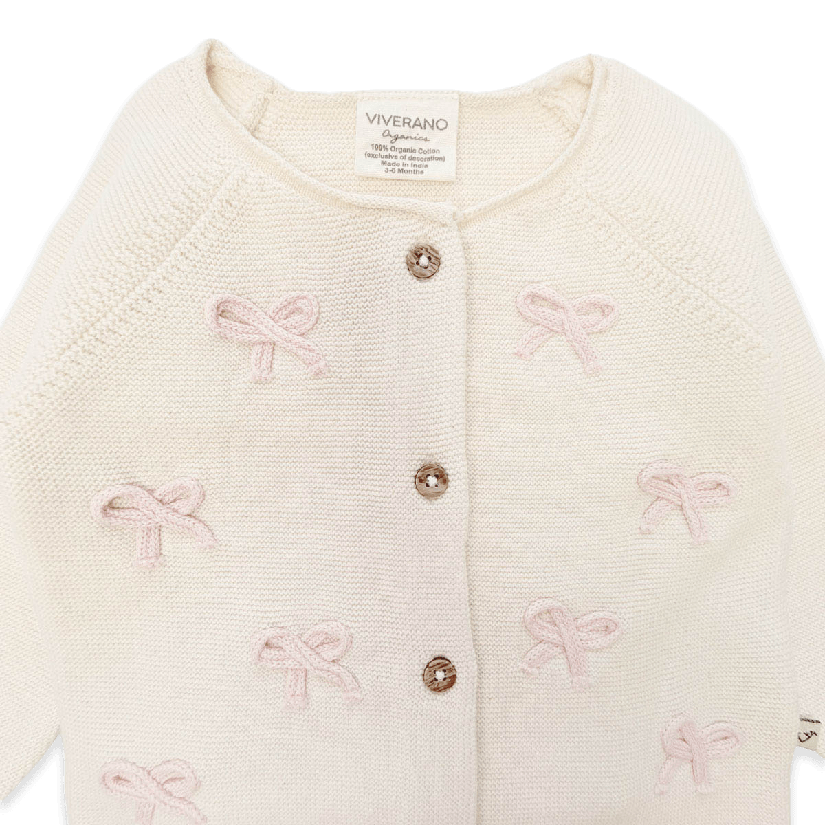 Viverano Organics baby cardigan in cream with pink bow embroidery and wooden buttons